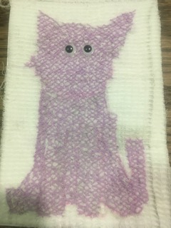 Cat sewn in cross stitch in lavender embroidery thread