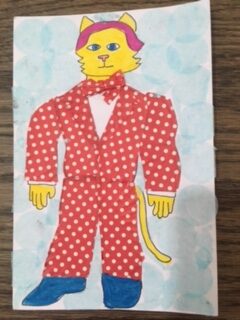 Cat-Man in white polka dot suit with matching bow tie