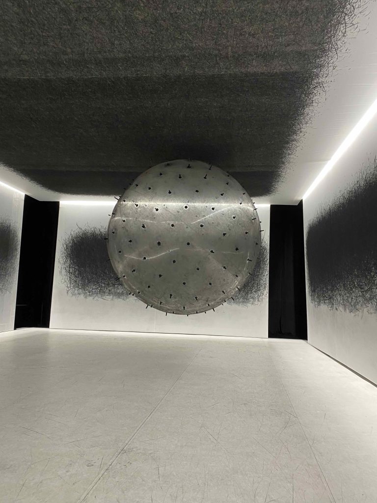 ADA the balloon spiking the walls & ceiling with charcoal marks