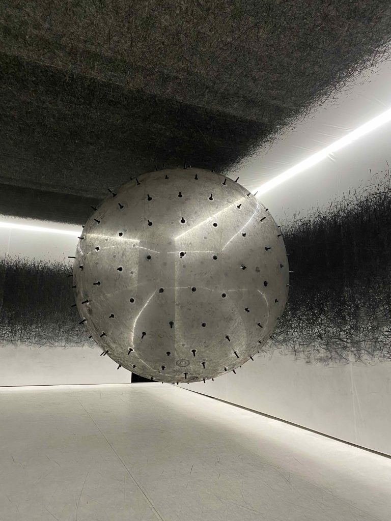 ADA the balloon spiking the walls & ceiling with charcoal marks