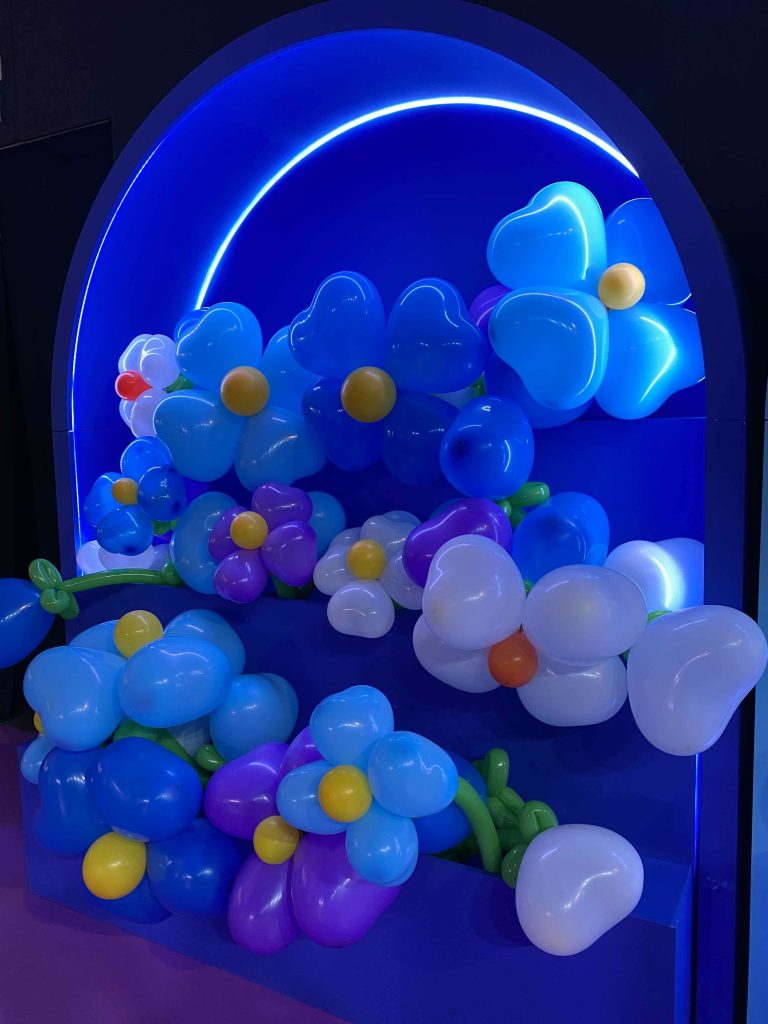 Balloon sculptured flowers wait for customers