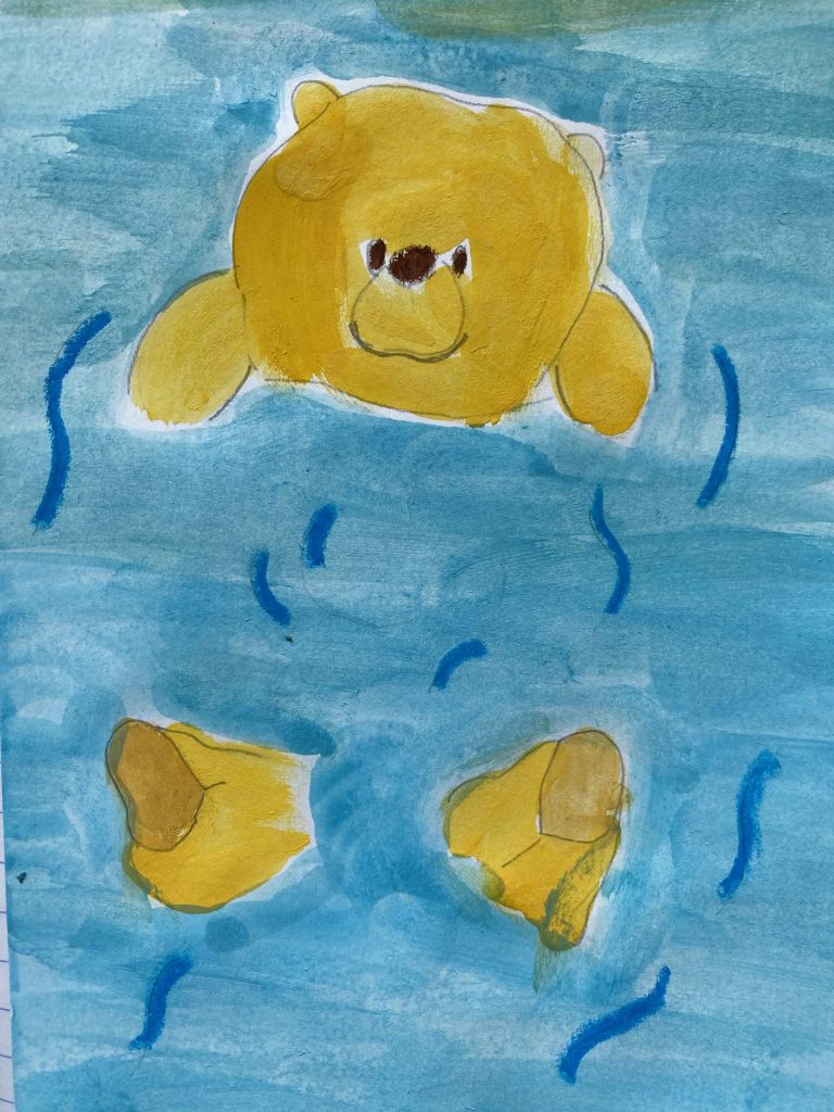 Pooh floats in water.