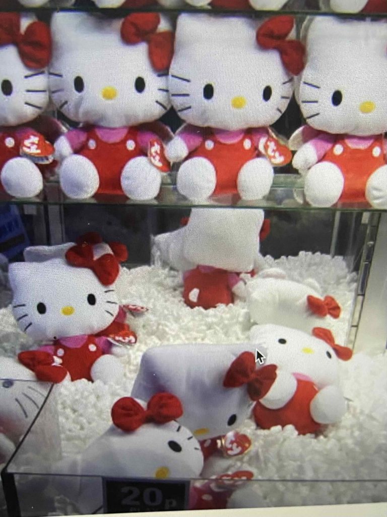 Hello Kitty dolls inside claw machine