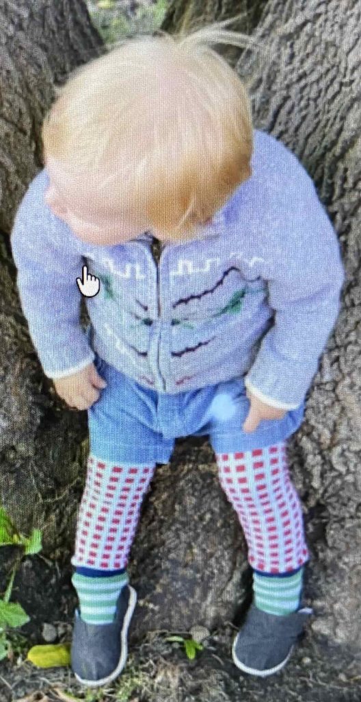 Sweater over top, shorts over leggings.