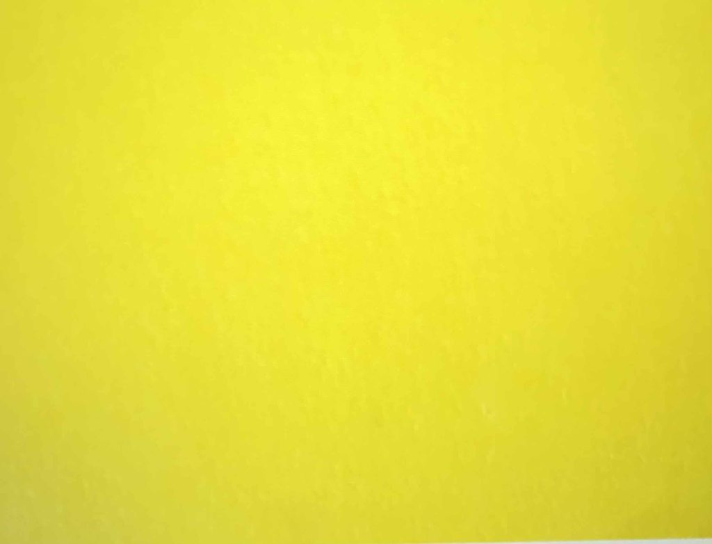 Small piece of yellow paper.